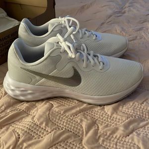 BRAND NEW AND NEVER WORN!  Nike White Sneakers with Silver Nike Sign